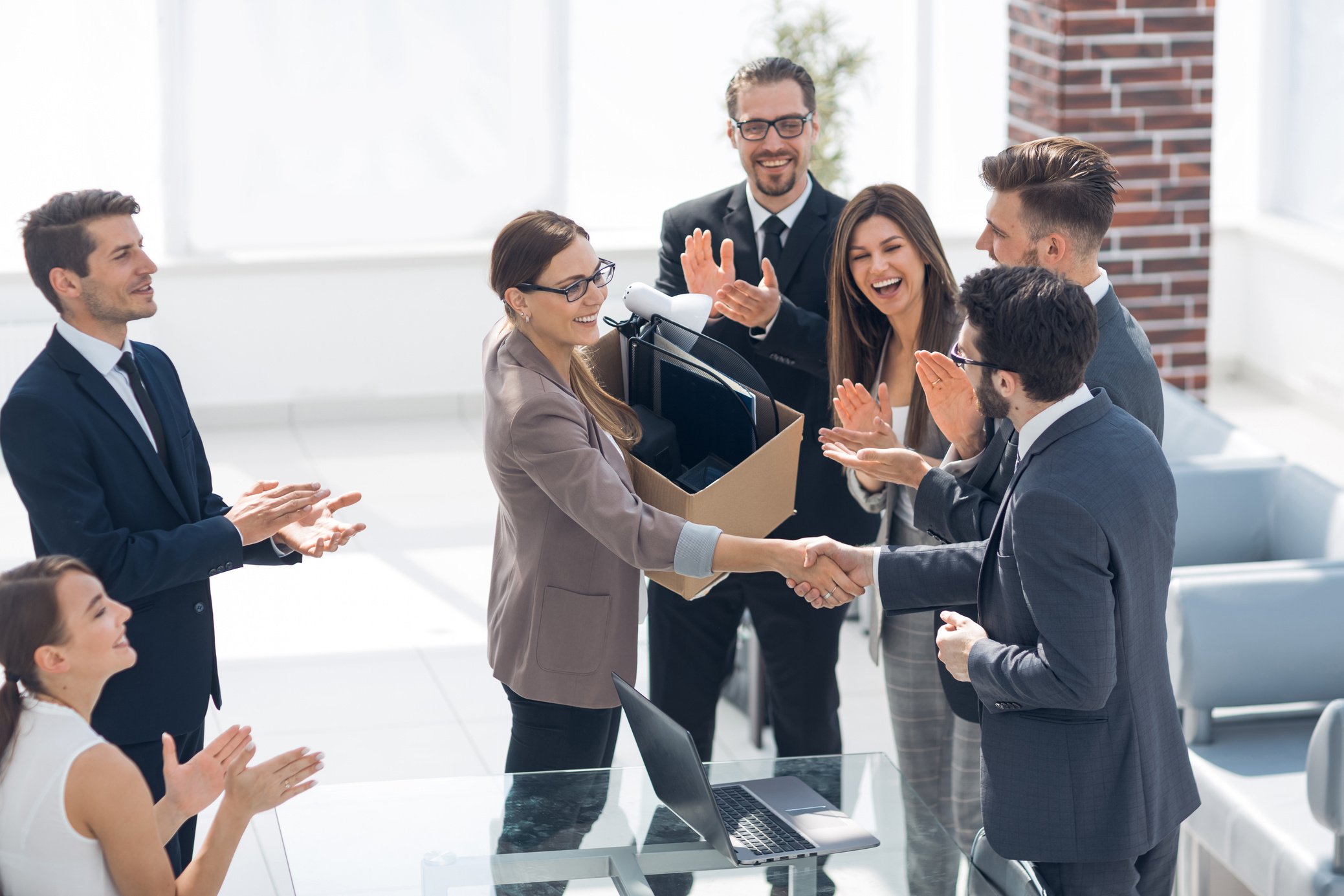 boss shaking hands with a new employee